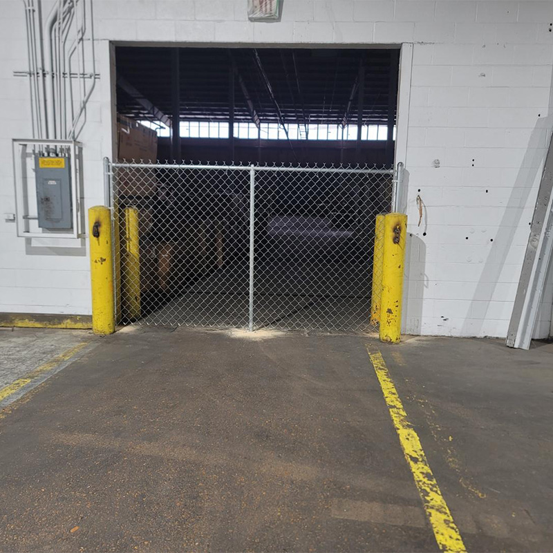 commercial chain link fence at opening for air flow in the warehouse