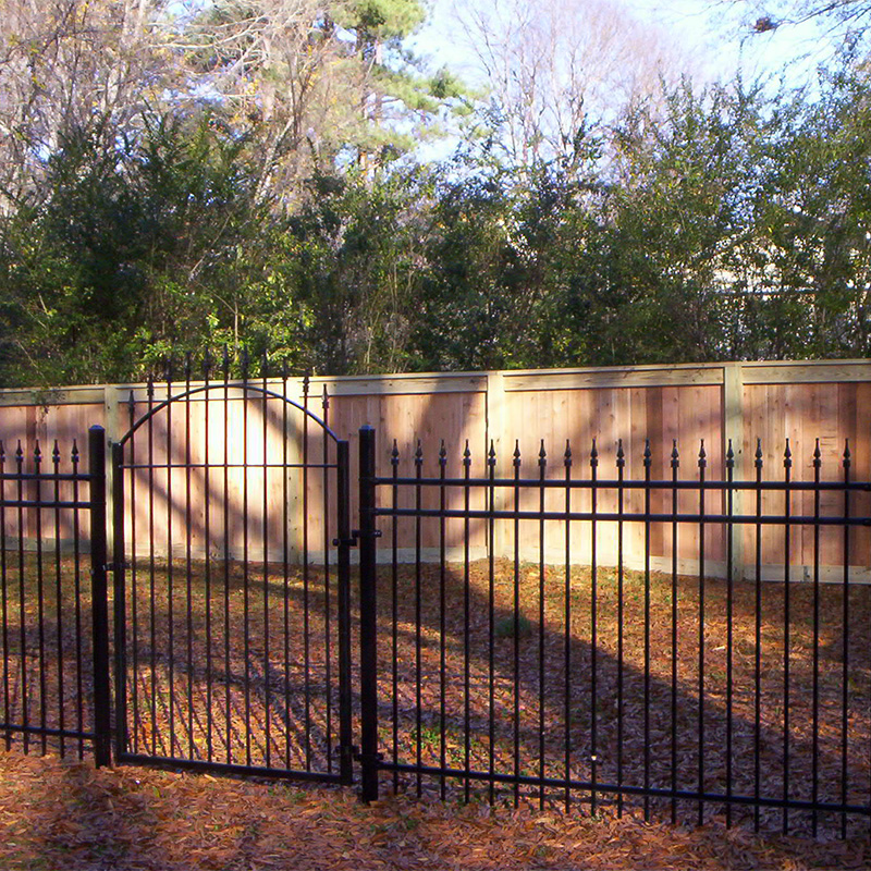 decorative steel fence with wood fence